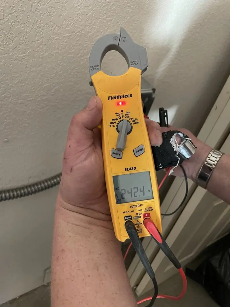 Voltage testing with clamp meter during Generator Installation in Wolcott